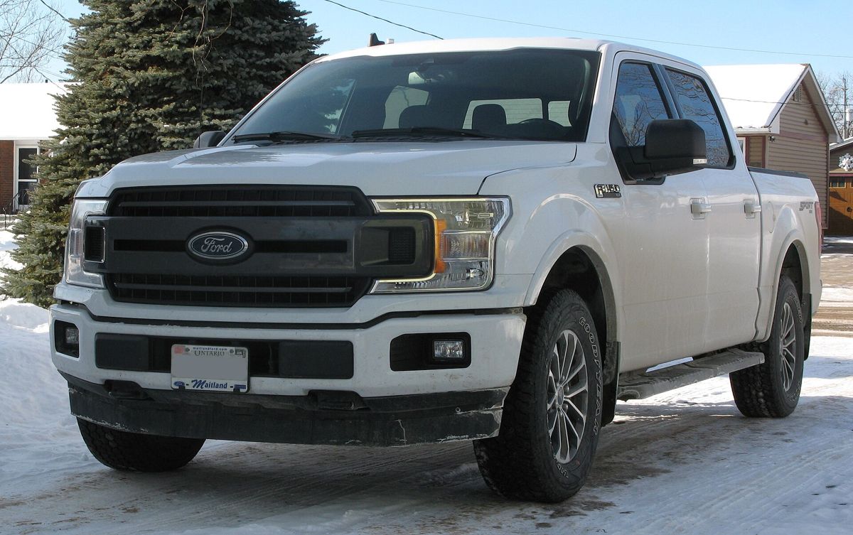 White Ford F-150 pickup truck in winter